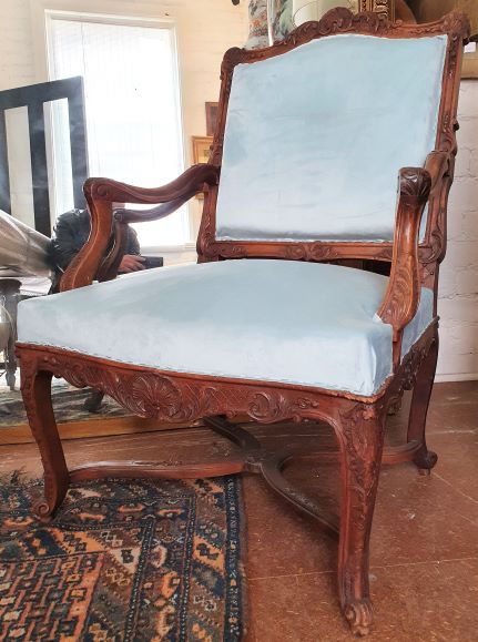 A pair of French Regence Fauteuils