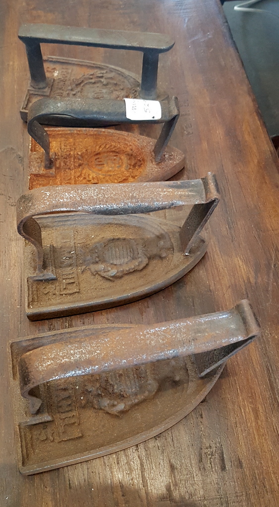 A pair of French Clothes Irons (door-stops)
