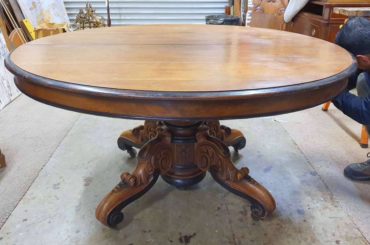 An extending French Pedestal Dining Table